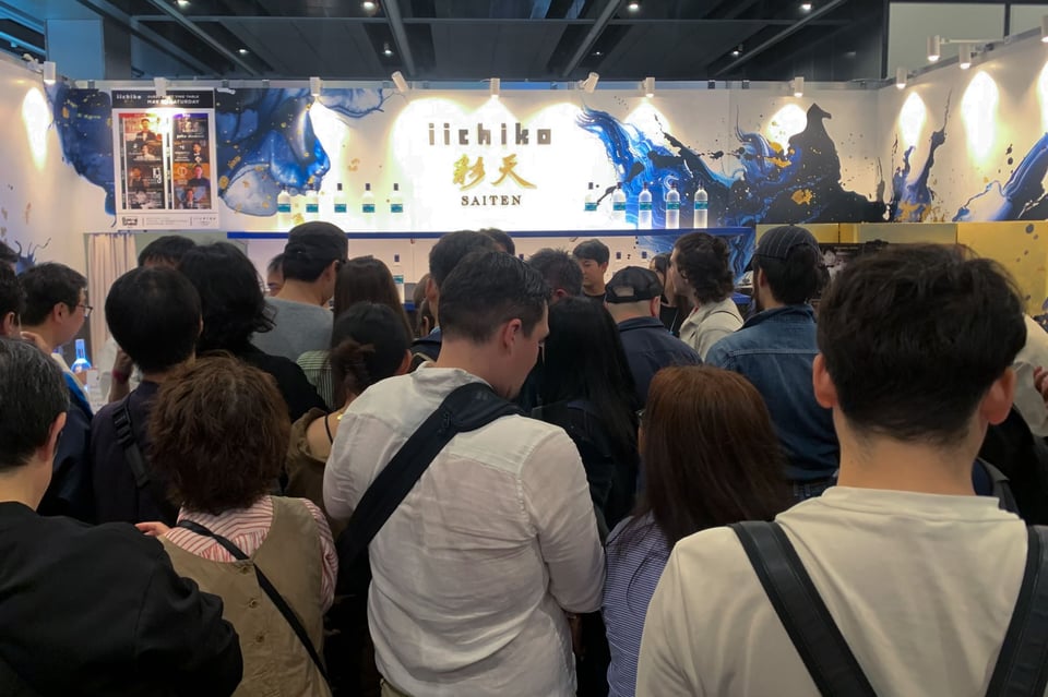 The Sanwa Shurui booth attracting a large crowd of attendees.