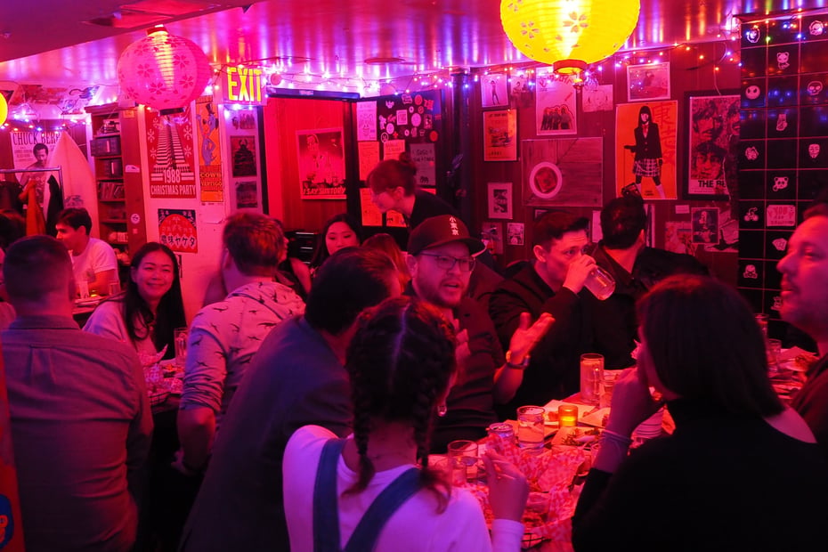 A group of contestants smiling and chatting together in a friendly, relaxed atmosphere during a get-together held the day before the competition.