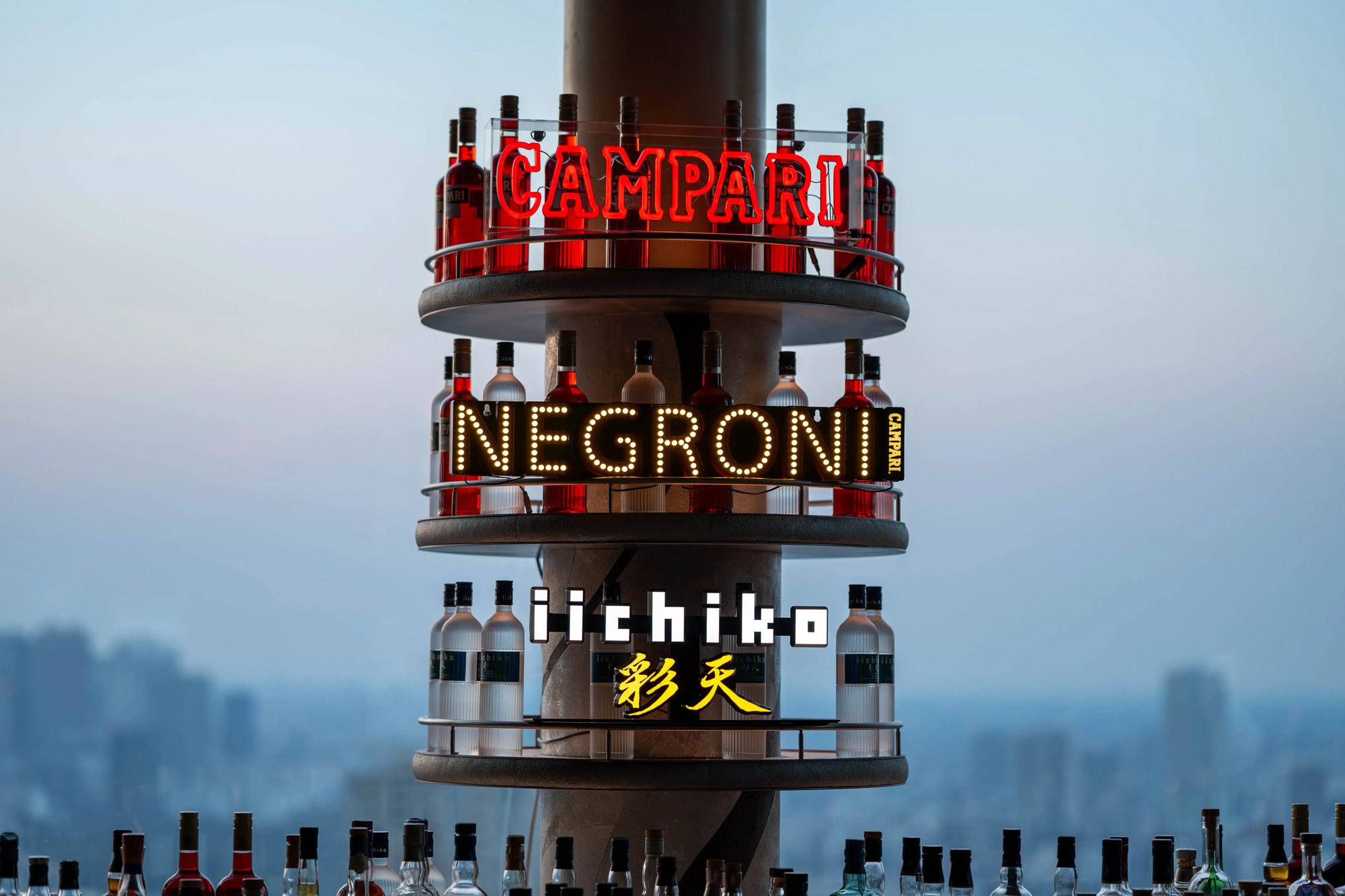 Display featuring the words Campari, Negroni, and iichiko Saiten