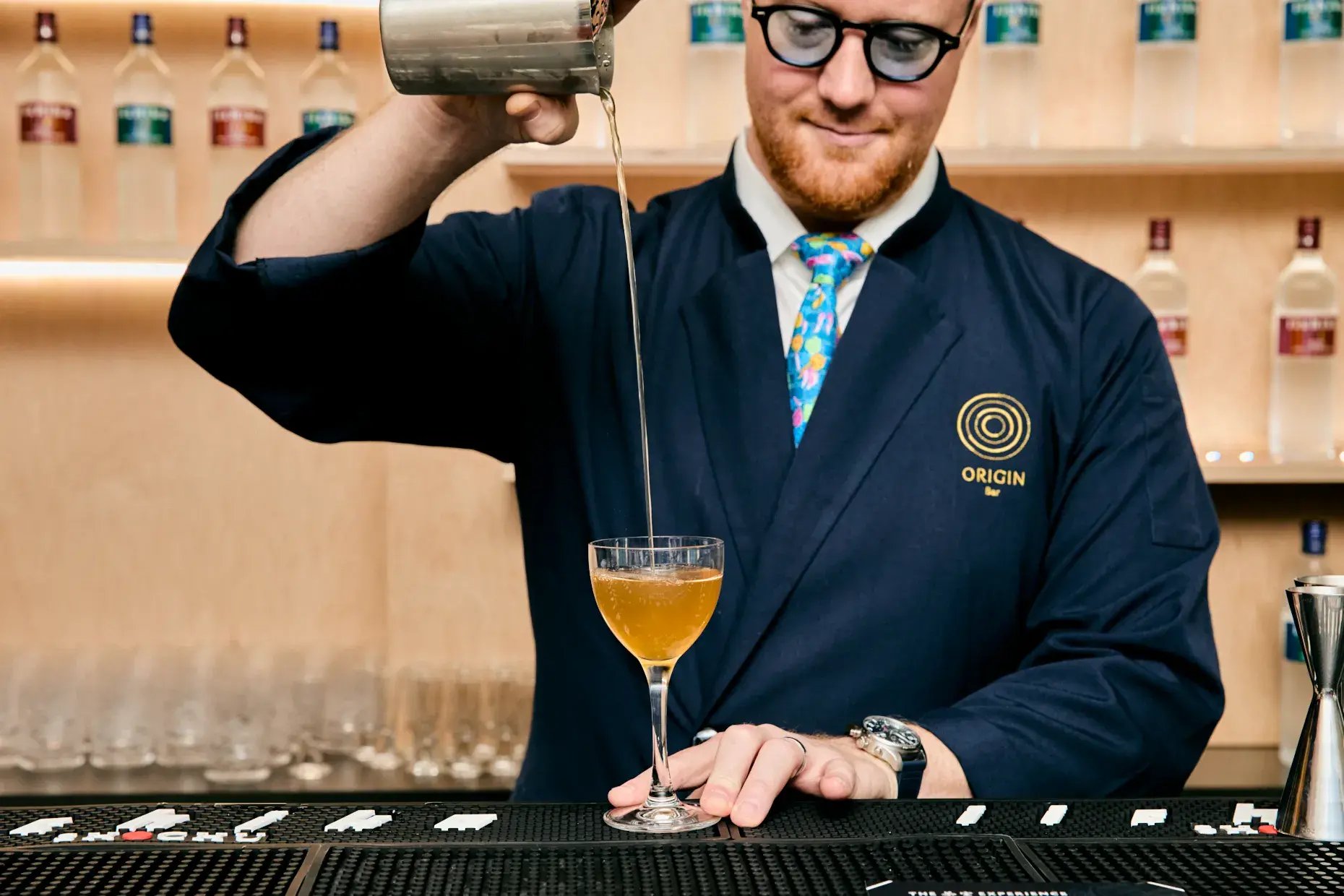 Adam Bursik of Origin Bar crafts The Fruit, a cocktail made with iichiko Shinwa.